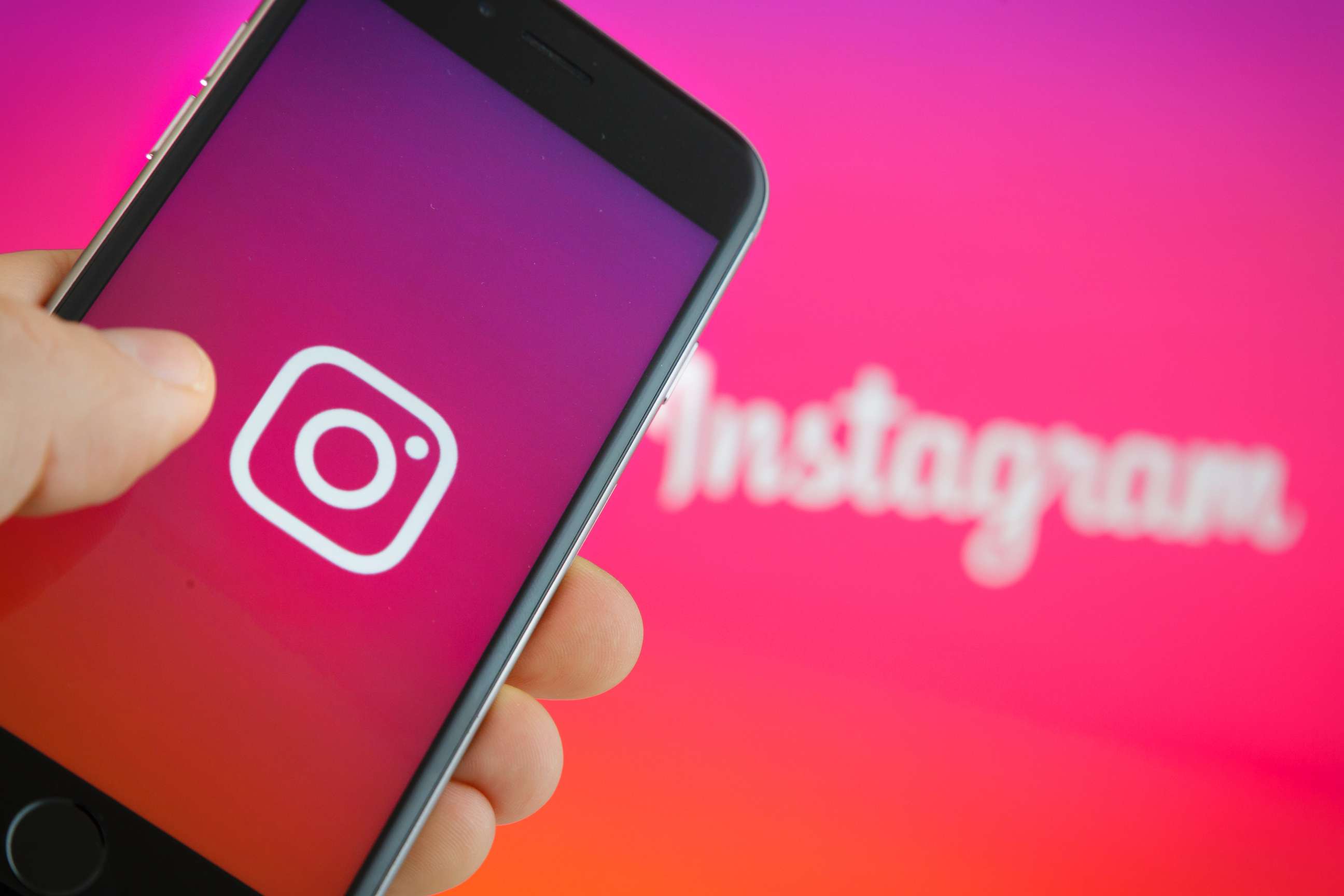 PHOTO: The logo of Instagram is displayed on a smartphone on September 27, 2016. Instagram has announced that they have unveiled new settings to help fight cyberbullying.