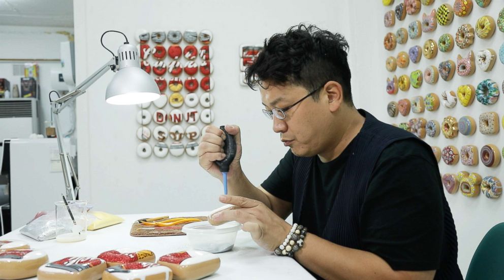 PHOTO: Artist Jae Yong works in his studio in Seoul, South Korea.