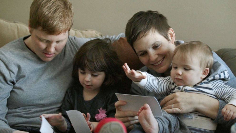 PHOTO: Jami and Krista Contreras with their two children in Michigan.