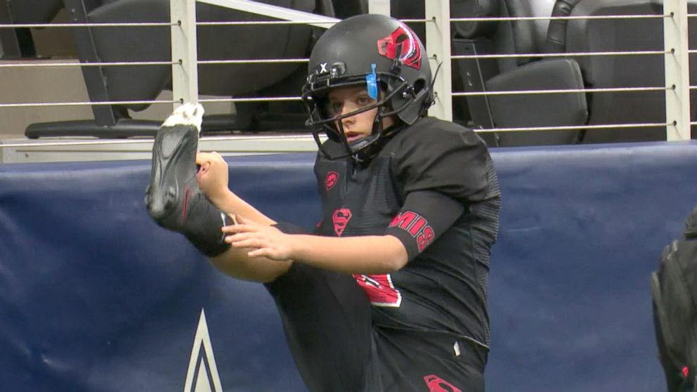 PHOTO: Strawn kicker K-Lani Nava practicing on the sidelines during a game.