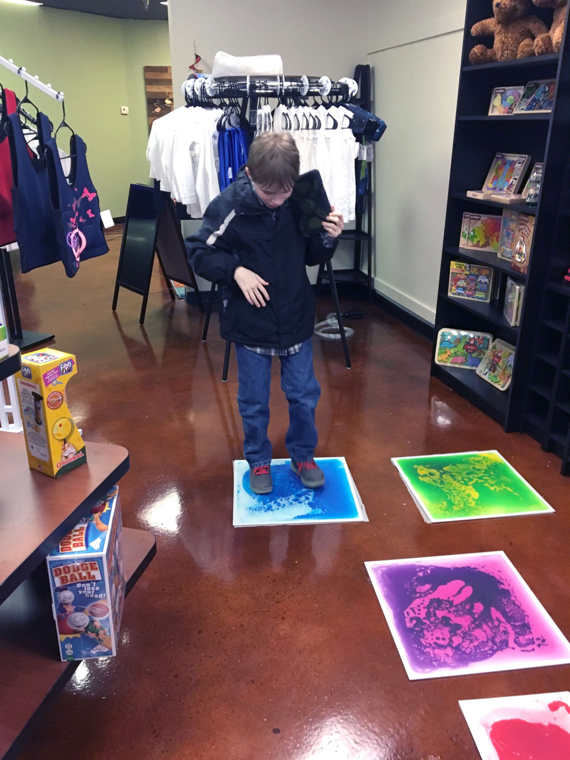 PHOTO: Parker Kahle, 13, enjoys an activity inside the Puzzle Pieces toy shop in Ohio.