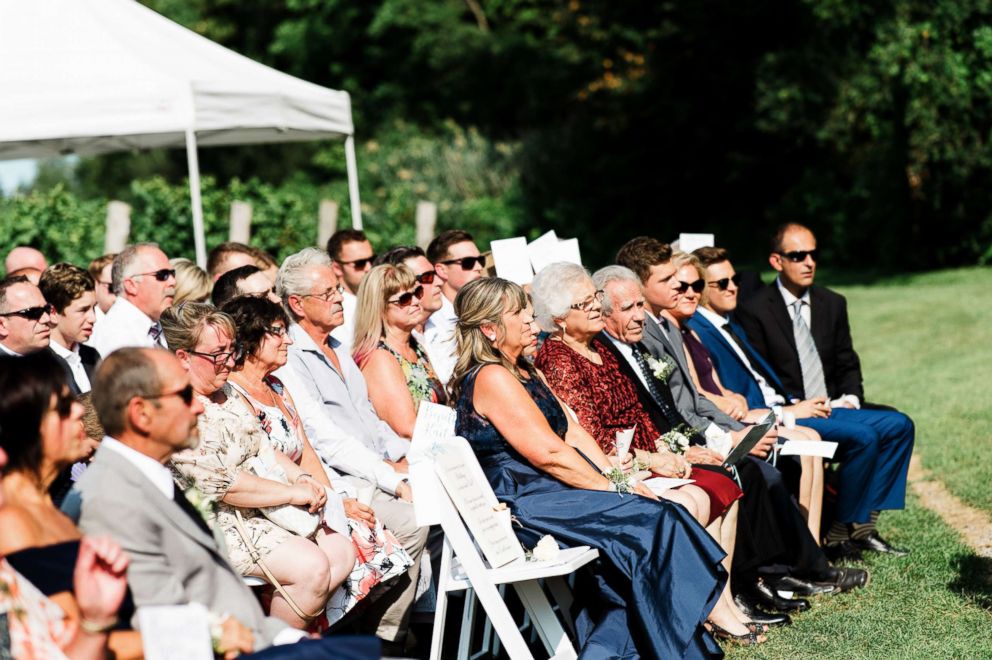 PHOTO: A chair was left empty at Kait Olidis and Benett Hallas' wedding on Aug. 26, 2017 after Olidis' father passed away two years earlier from cancer.