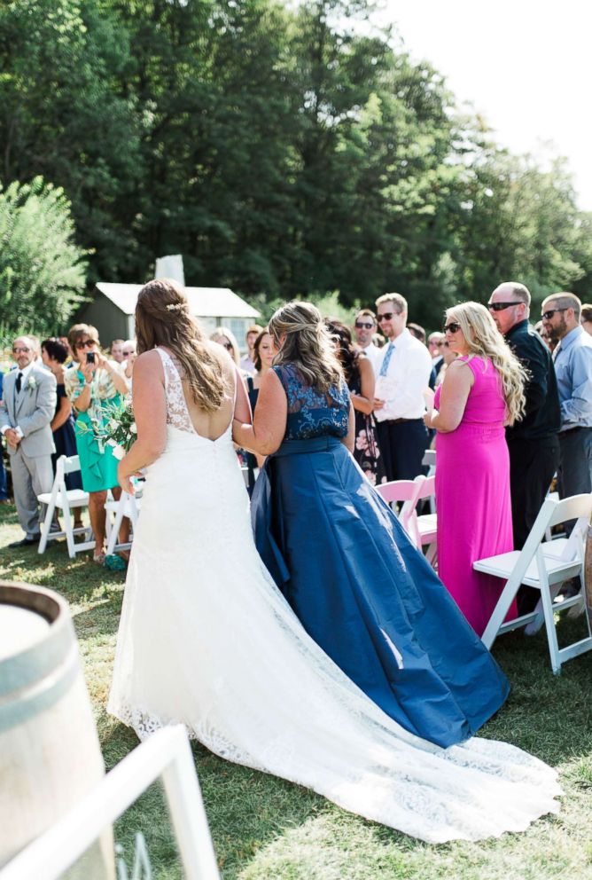 PHOTO: Bride Kait Olidis's mother, Cathy, walked her down the aisle on her big day.