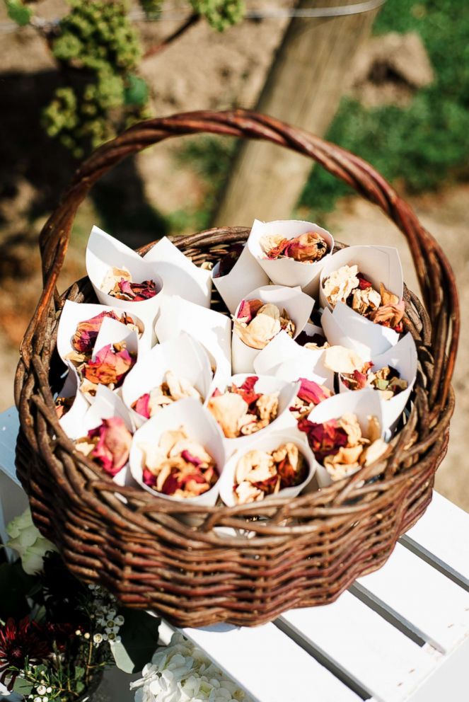 PHOTO: Dried rose petals from Jim Olidis' 2015 funeral served as confetti at Kait Olidis' wedding two years later.