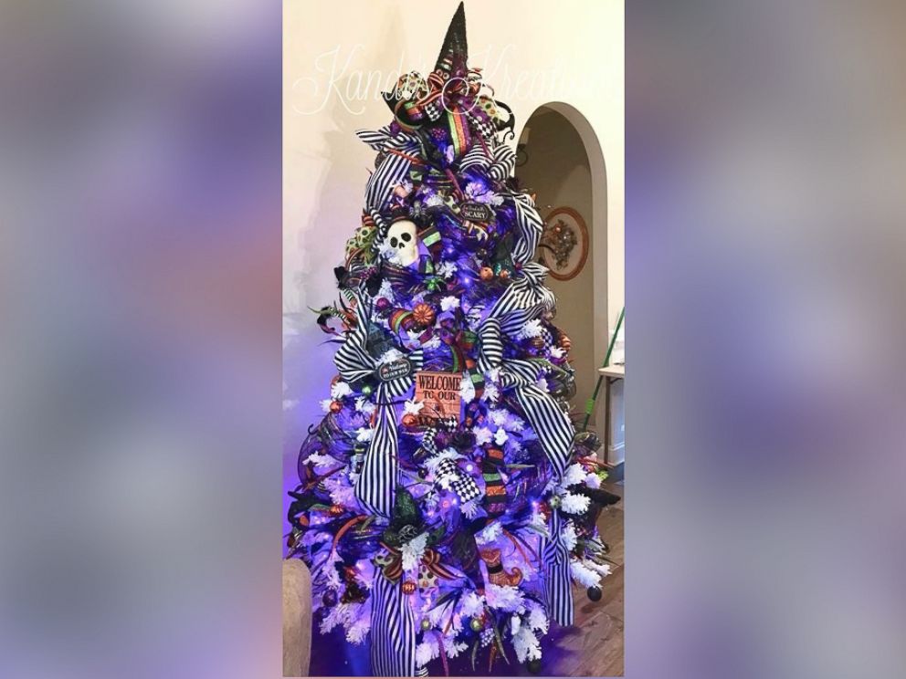 PHOTO: Kandi Jung, owner of Kandi's Kreations, decorated a Halloween tree with purple lights and topped it with a witch's hat.
