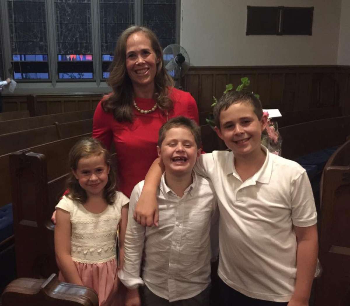 PHOTO: Kara Yimoyines seen in an undated photo with her children, Hudson, 11, Vivian and Beckett, both 9, at a benefit in her honor. 