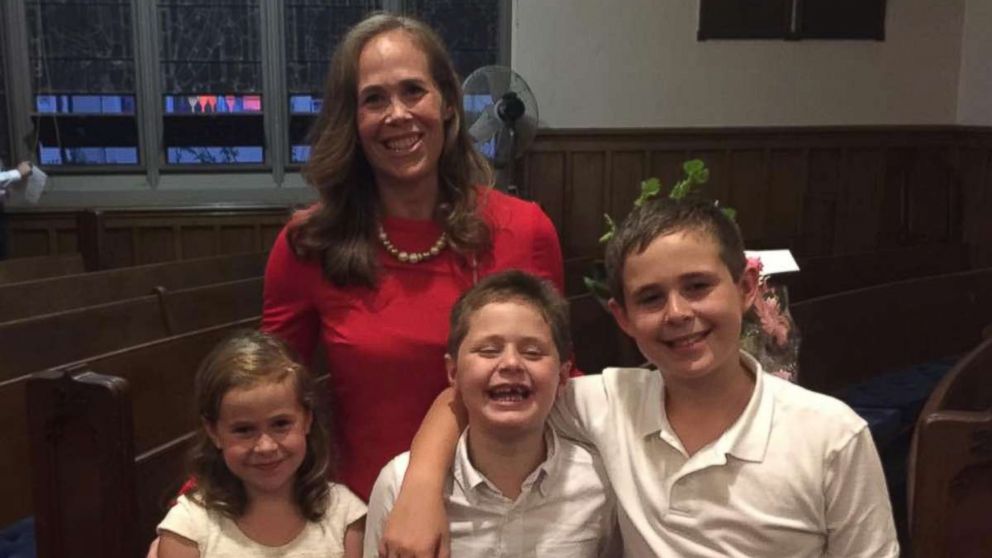 PHOTO: Kara Yimoyines seen in an undated photo with her children, Hudson, 11, Vivian and Beckett, both 9, at a benefit in her honor. 