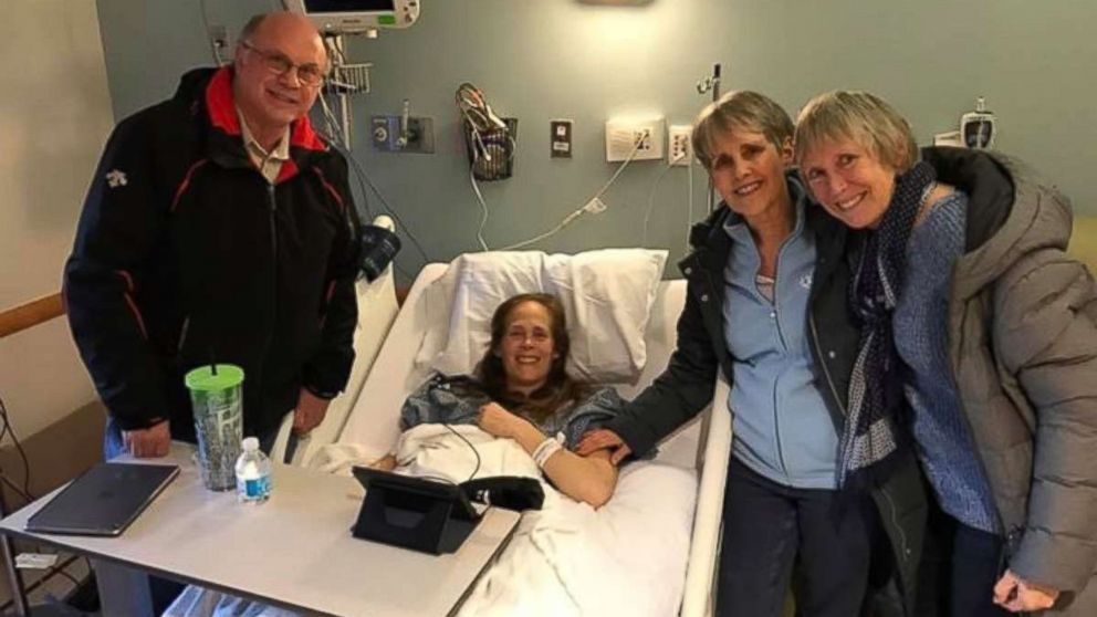 PHOTO: Kara Yimoyines seen as a patient at Tufts Medical Center in Boston, Massachusetts, with her father F. Barry Knotts (left), mom Wendy Horton and step mother, Denise Knotts. 
