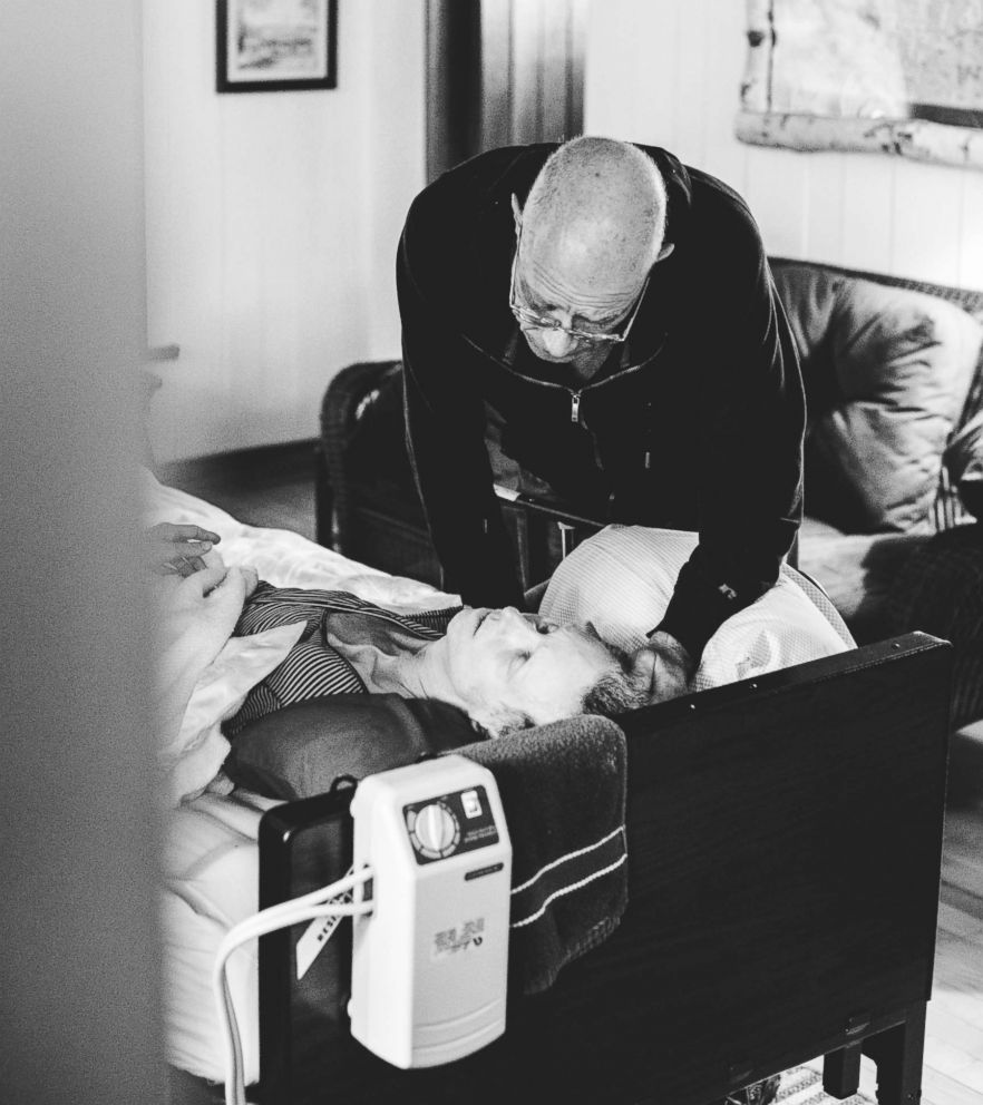 PHOTO: Doug Fuller (father) checks on Sharon Fuller (mother) in the final days of her life at Combe’s family cottage in Northern Michigan.