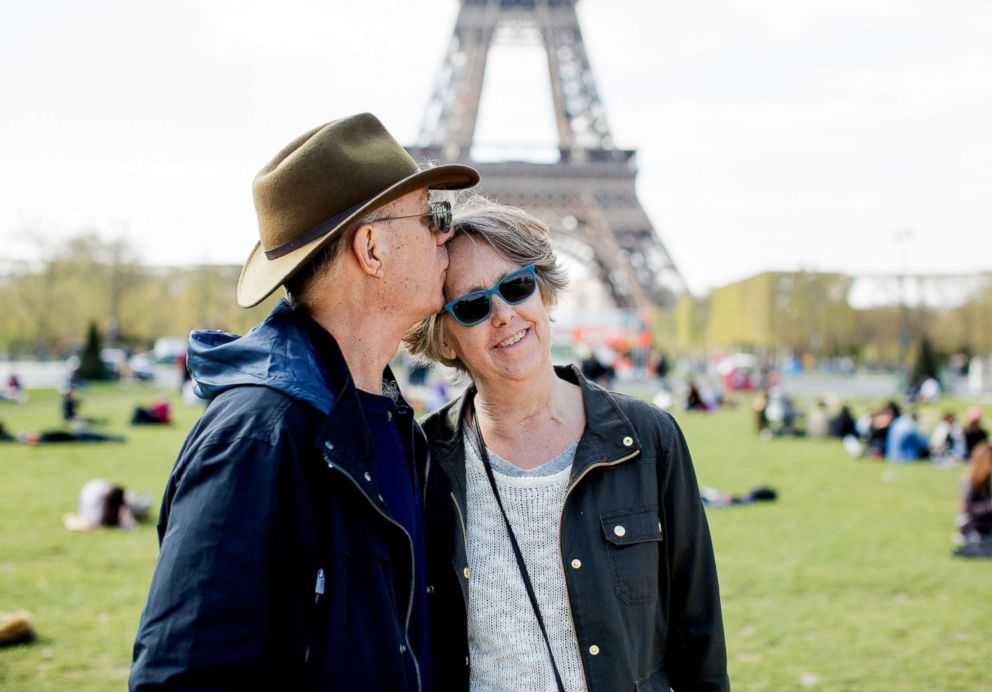 PHOTO: Doug Fuller kisses Sharon Fuller in Paris, April 2016, after her cancer had returned and she was diagnosed as terminal three months prior to the trip.