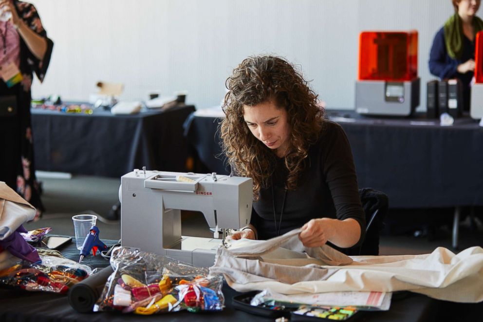 PHOTO: A participant uses the sewing station at the 2018 Make the Breast Pump Not Suck Hackathon at MIT.