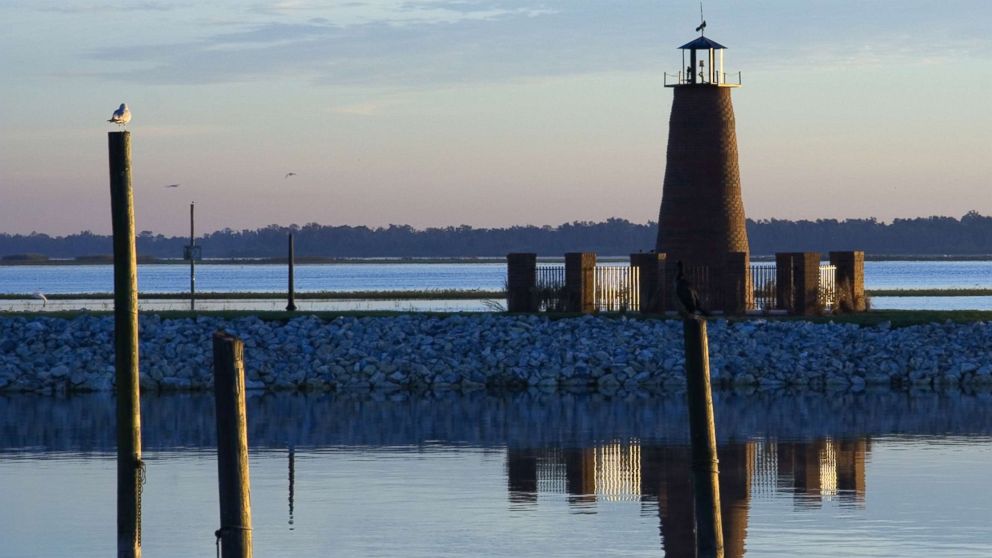 Lake Tohopekaliga and a lighthouse are shown in the early morning in an undated stock photo. 