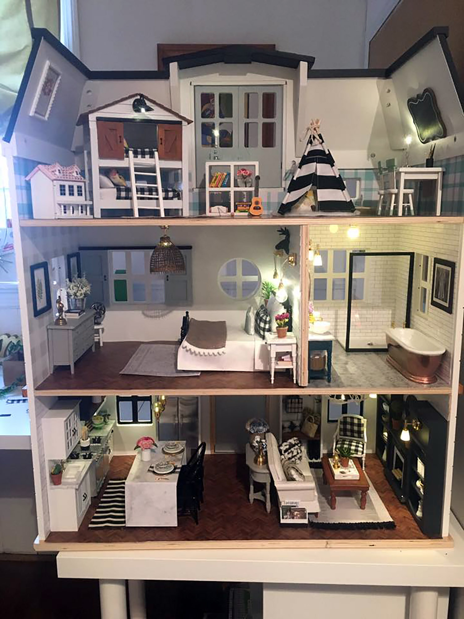 PHOTO: Kwandaa Roberts hand-painted and built furniture for her "Fixer Upper" inspired-dollhouse.