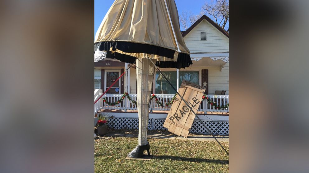 PHOTO: The giant leg lamp is made from a pool pole, Christmas lights, wood, cardboard, a volleyball net and fabric.