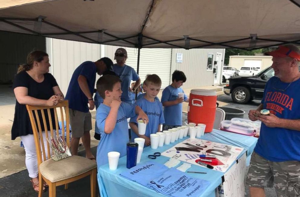 PHOTO: Matt Emery and Melissa Goldman Emery's son Andrew, 9, set up a lemonade stand to help pay for his brother Dylan's medical bills. 