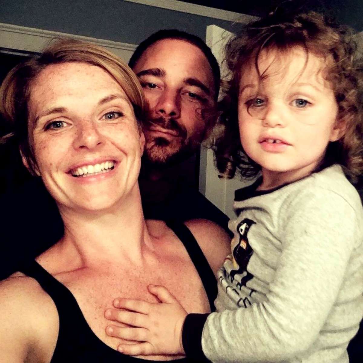 PHOTO: Liz Petrone, of Syracuse, New York, poses with her husband, Nick, and their youngest child, Luca.
