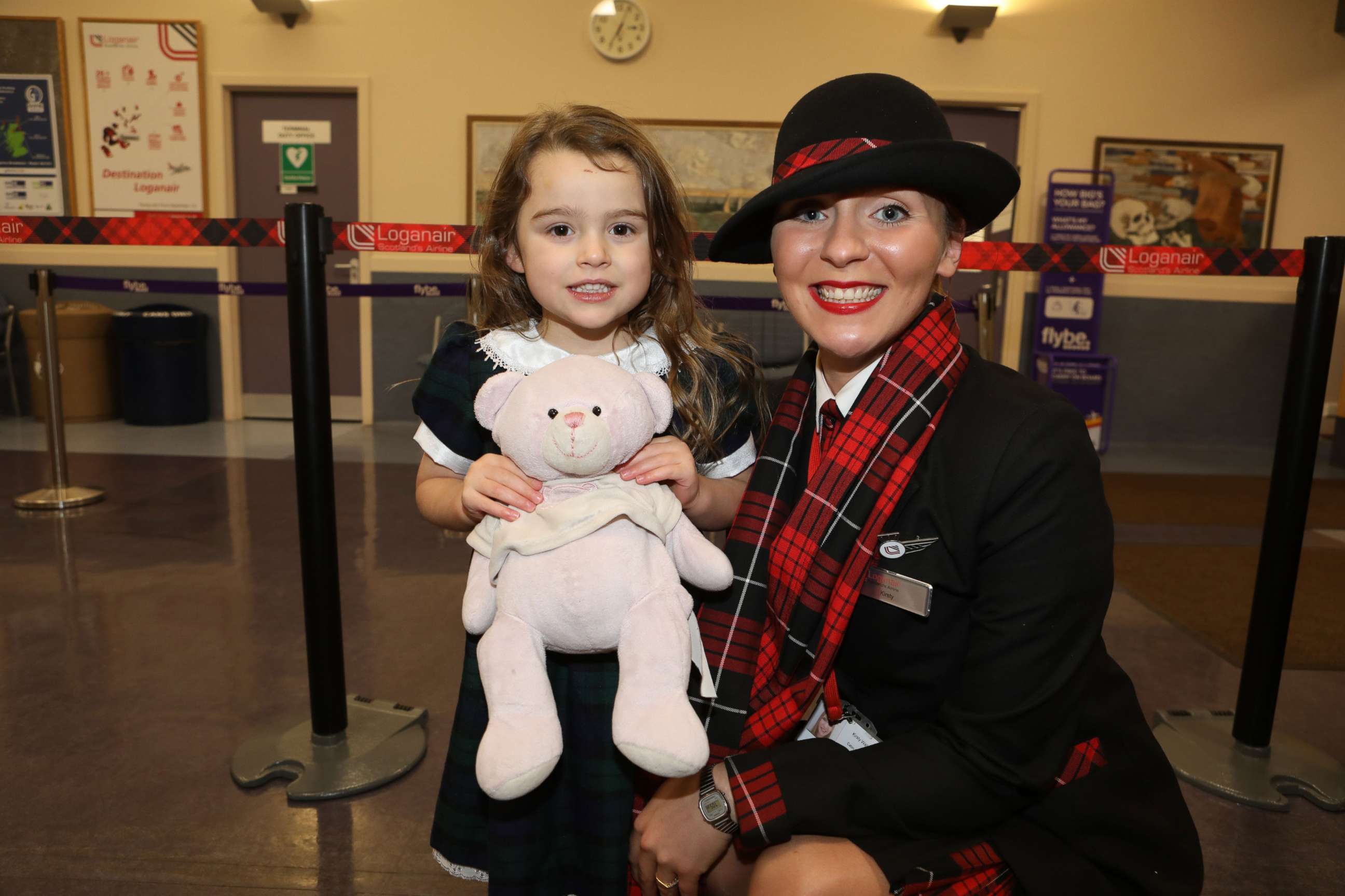 PHOTO: 4-year-old Summer, whose last name was asked to be withheld, with Loganair cabin crew member Kirsty Walter.