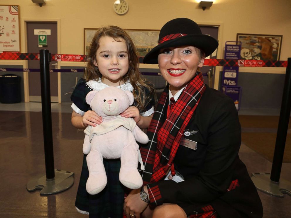 PHOTO: 4-year-old Summer, whose last name was asked to be withheld, with Loganair cabin crew member Kirsty Walter.