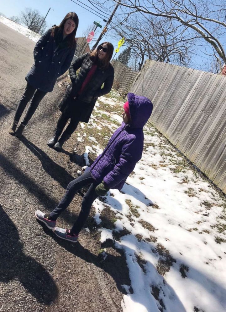 PHOTO: Madelyn Gerker seen in an undated photo with Councilman P.G. Sittenfeld's staff as she shows them the broken pavement she walks on to school.