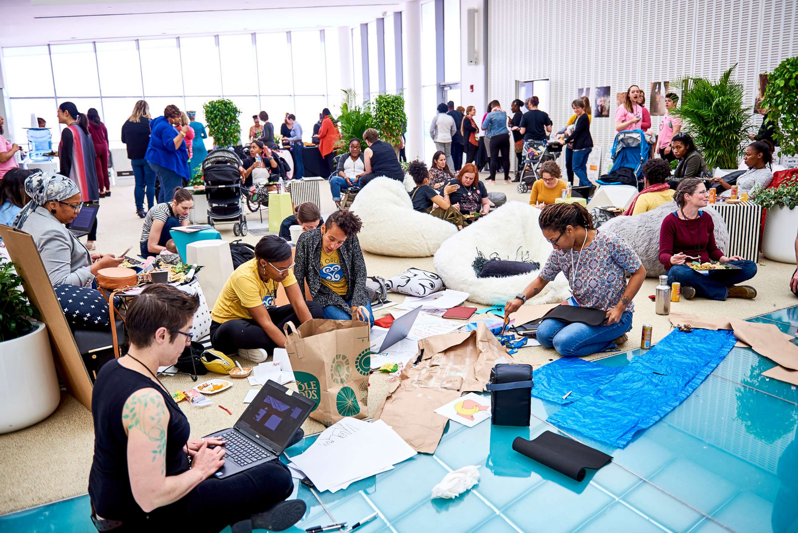 PHOTO: Participants discuss ideas at the 2018 Make the Breast Pump Not Suck Hackathon at MIT.