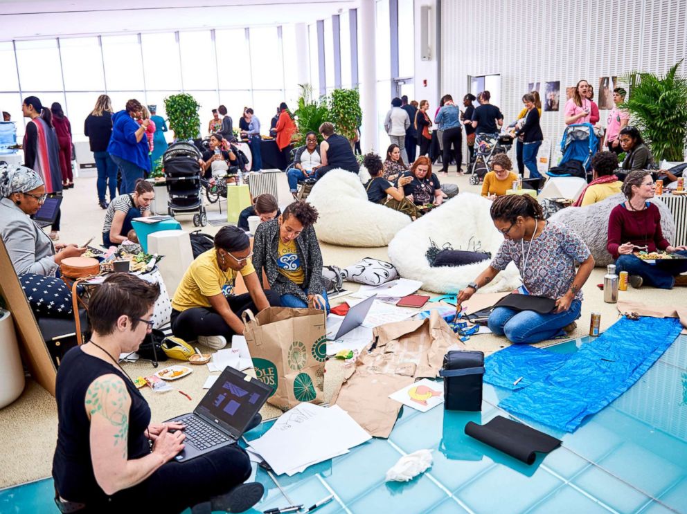 PHOTO: Participants discuss ideas at the 2018 Make the Breast Pump Not Suck Hackathon at MIT.