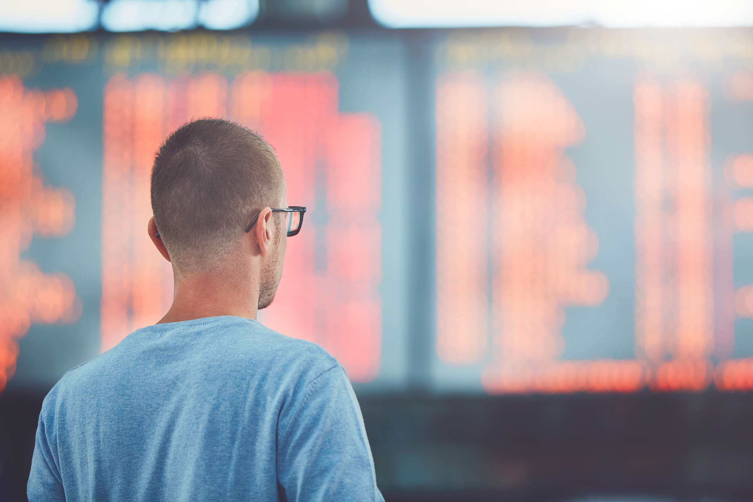 PHOTO: A young traveler watches information about his flight on the departure board at the airport in this undated stock photo.