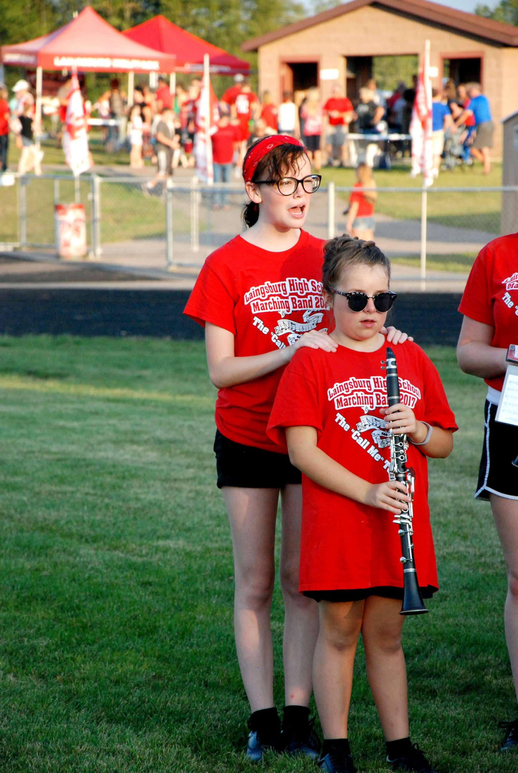 PHOTO: Autumn Michels, 14, who is visually impaired is guided in her high school's marching band by a fellow student, 17-year-old Rachael Steffens.