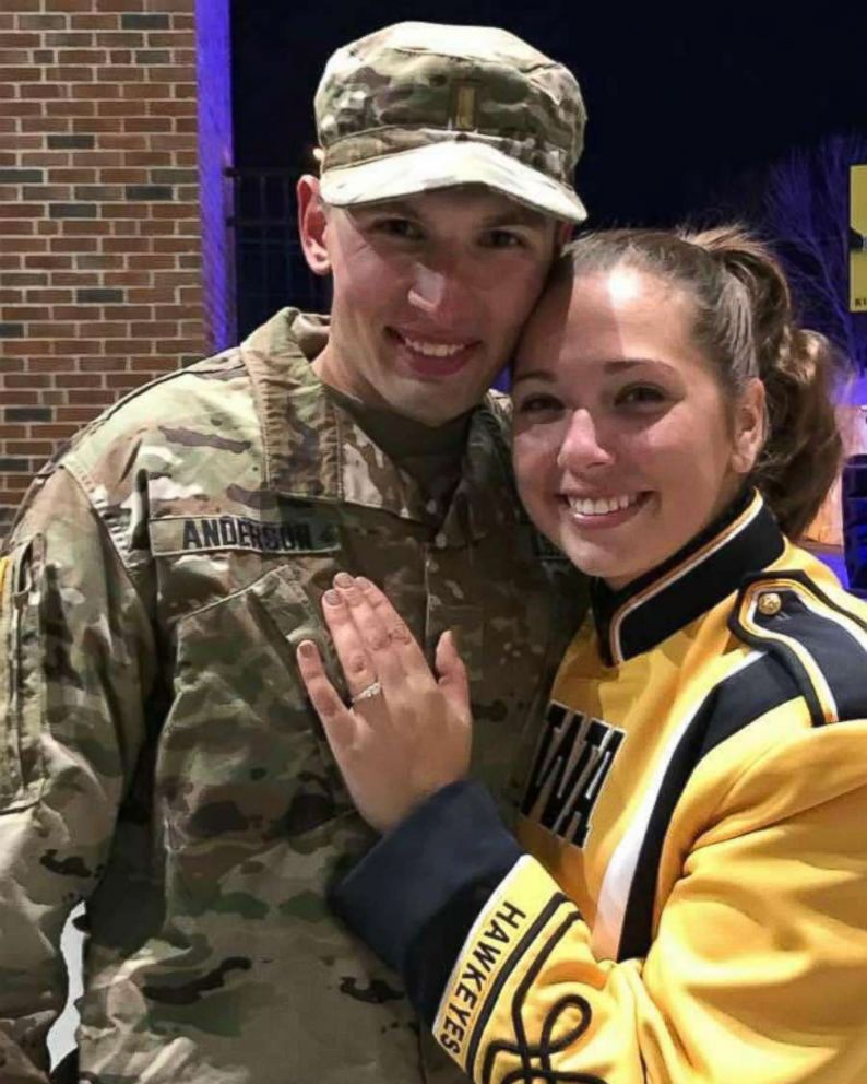 PHOTO: Isaac Anderson and Grace Schebler smile for the camera as she shows off her new diamond engagement ring.