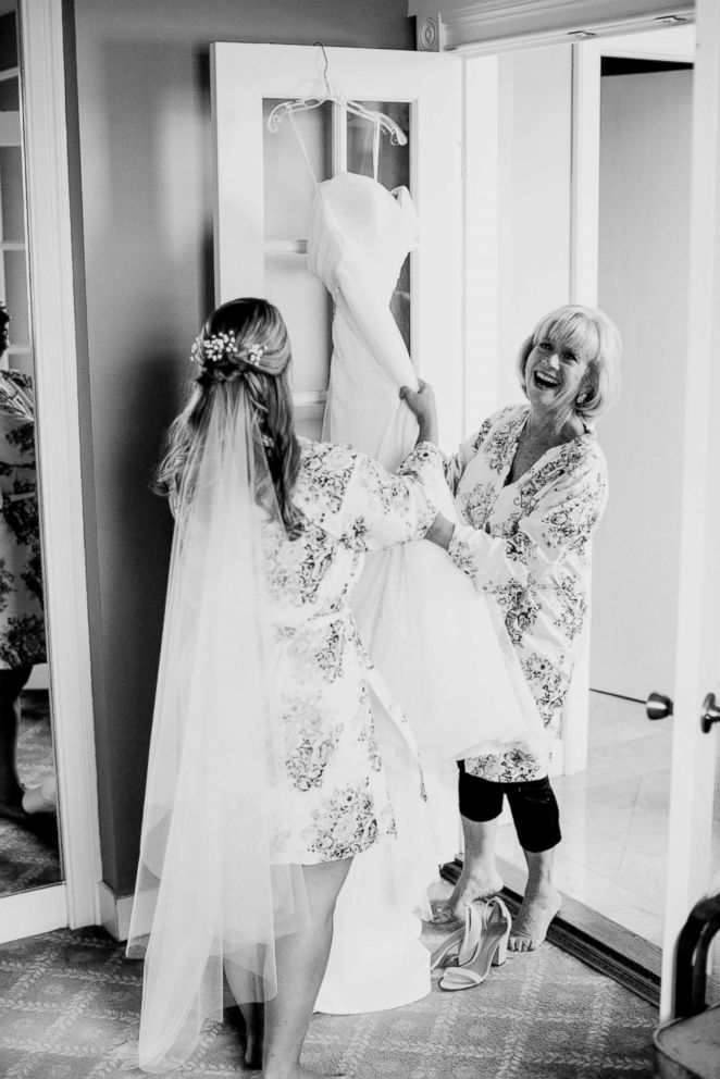 PHOTO: Sarah Marks (bride) and her mother Susan get ready before Sarah’s wedding on Sep. 30, 2017, five days after Combe’s father died.