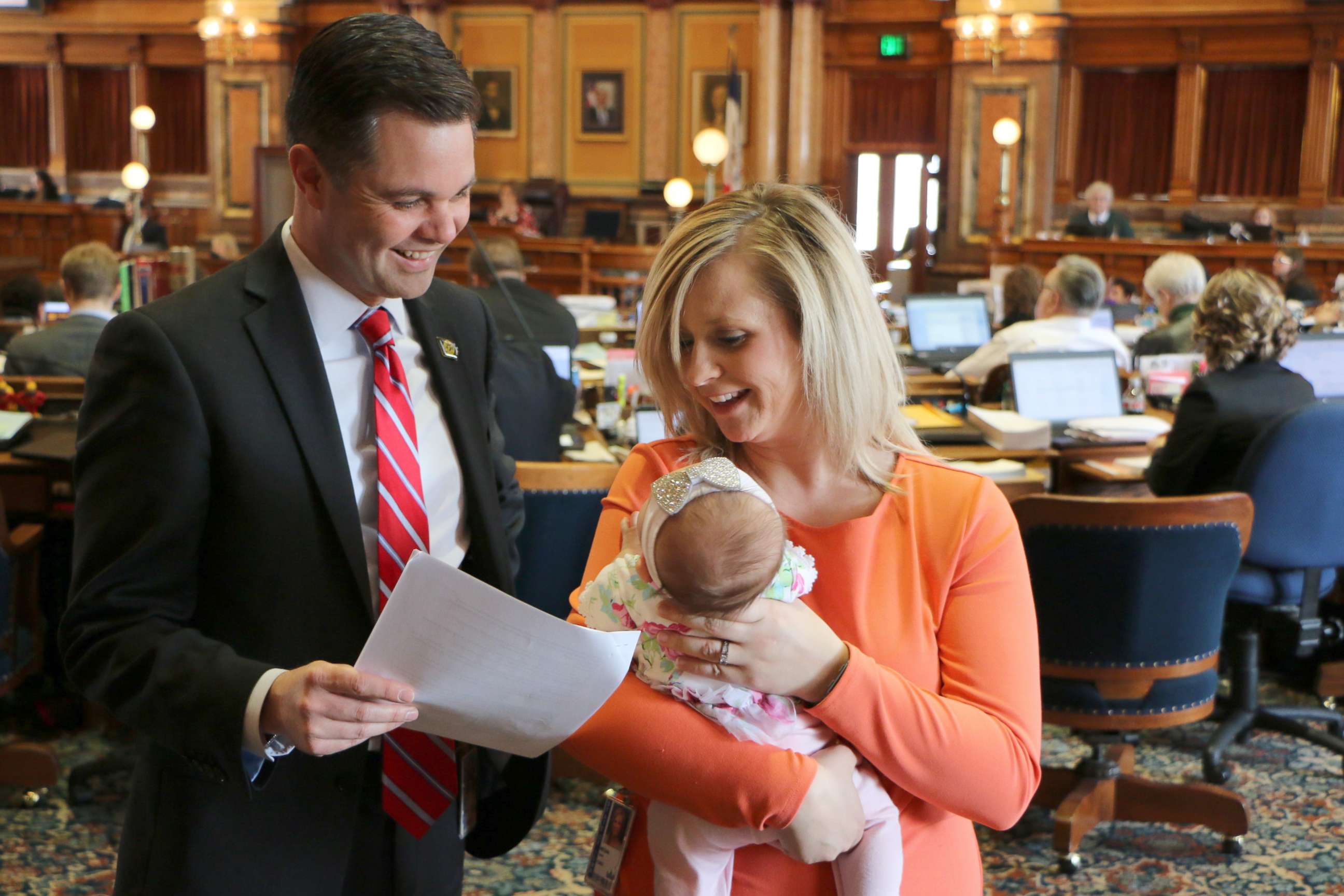 PHOTO: Rep. Megan Jones holds, Alma, who is less than 2 months old, to the House floor and meetings.