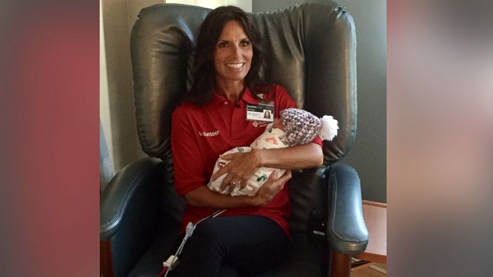 Laurie Mays is a volunteer with Miami Valley Hospital's volunteer infant cuddler program, which began in July 1, 2017. The baby pictured was not diagnosed with neonatal abstinence syndrome.