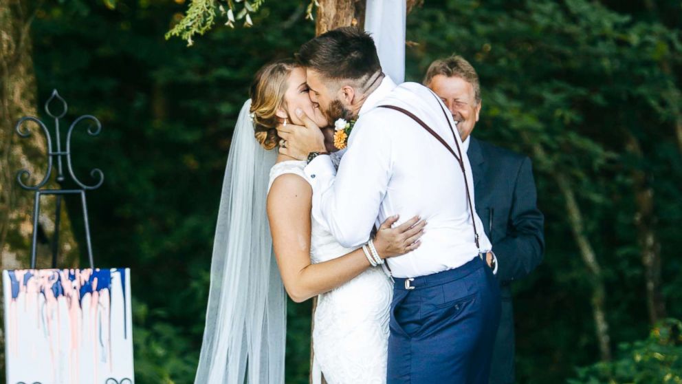 PHOTO: Micah Baker sheds tears of joy as his now wife, Bailey Baker, walks down the aisle at their wedding in Dandridge, Tenn.