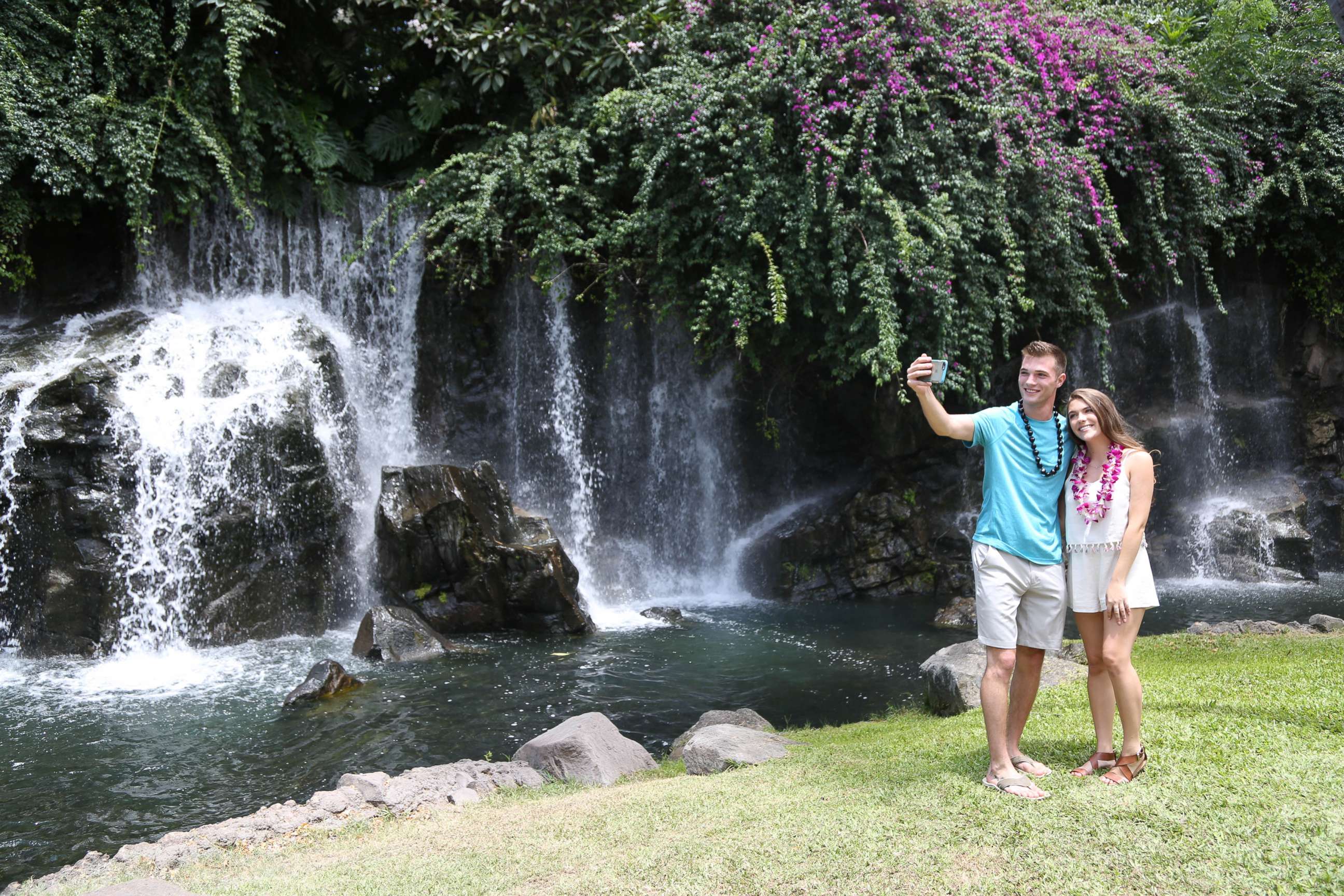 PHOTO: Josh and Michelle snap a selfie on their date in front of a waterfall in Maui.