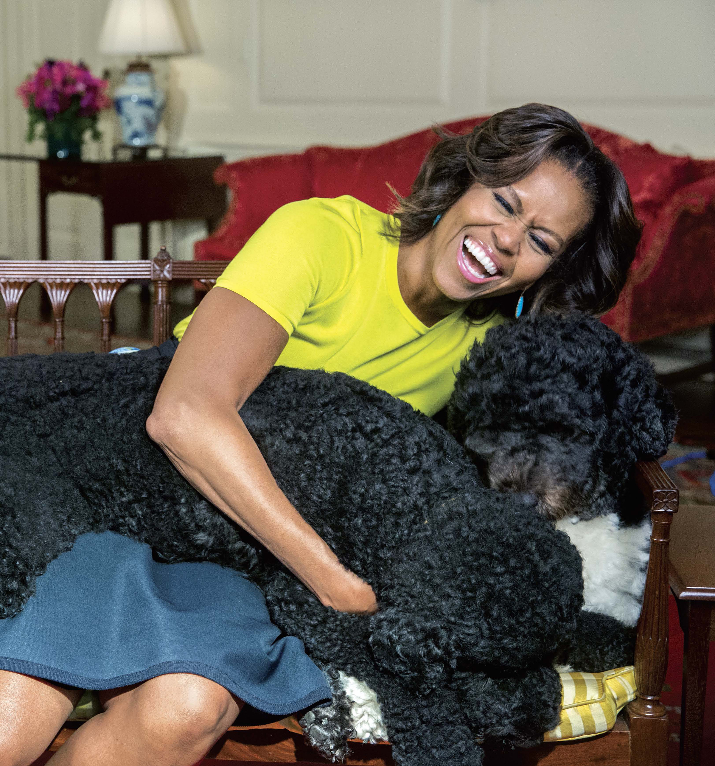 PHOTO: White House photographer Amanda Lucidon included a candid photo of Michelle Obama laughing with the first dogs in her new book, "Chasing Light."