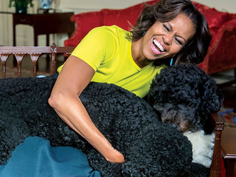 PHOTO: White House photographer Amanda Lucidon included a candid photo of Michelle Obama laughing with the first dogs in her new book, Chasing Light.