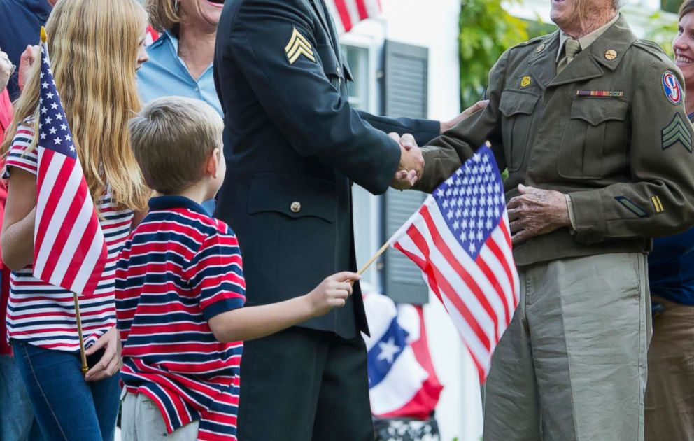 PHOTO: Children greet members of the military in an undated stock photo. 