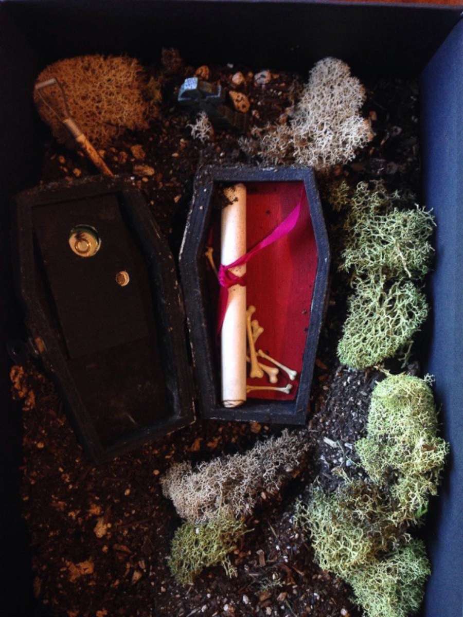 PHOTO: Cutler, a florist, hand-painted little coffins and buried them in potting soil inside a black photo box.