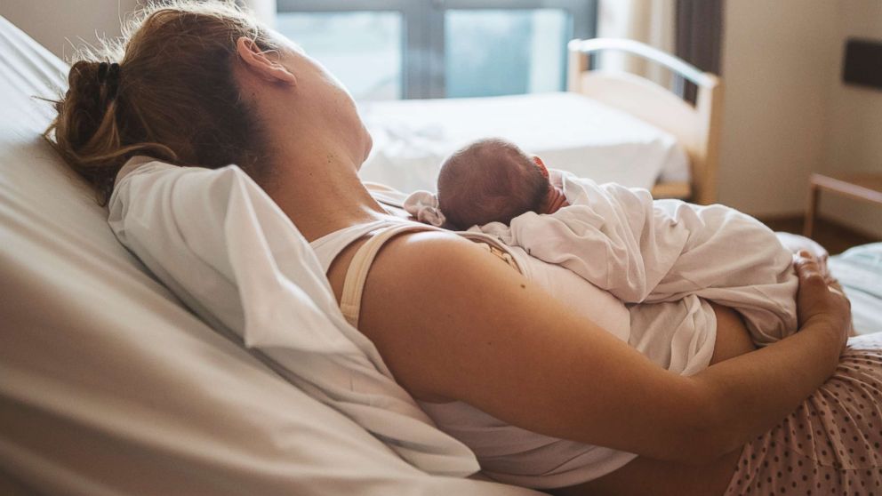 A mother with her newborn baby in the hospital, in this undated photo.