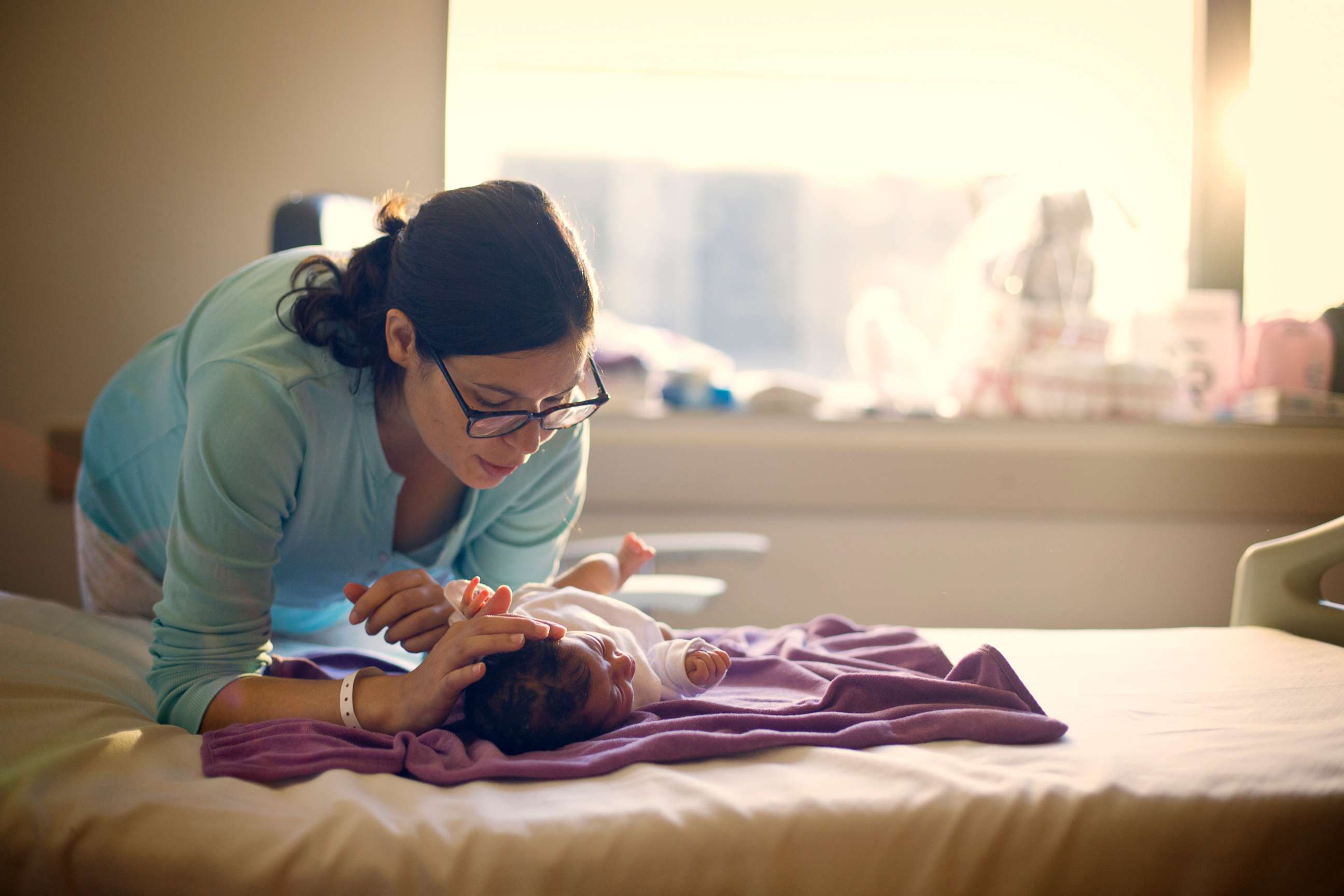 PHOTO: A mother sings to her newborn in this undated stock photo.