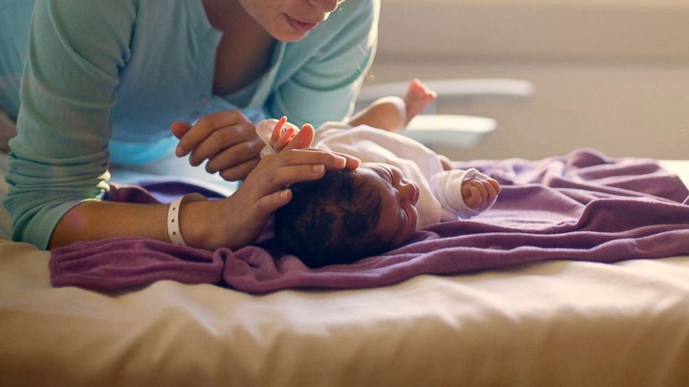 PHOTO: A mother sings to her newborn in this undated stock photo.