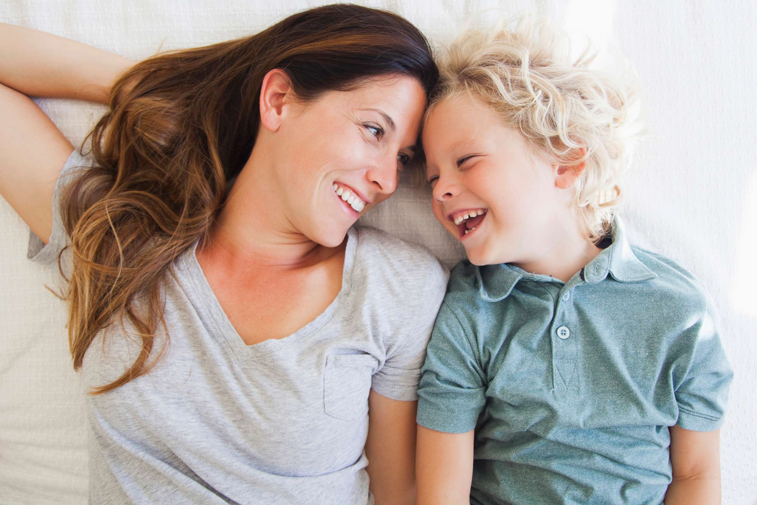 PHOTO: A portrait of a mother laughing with her son in this undated stock photo.
