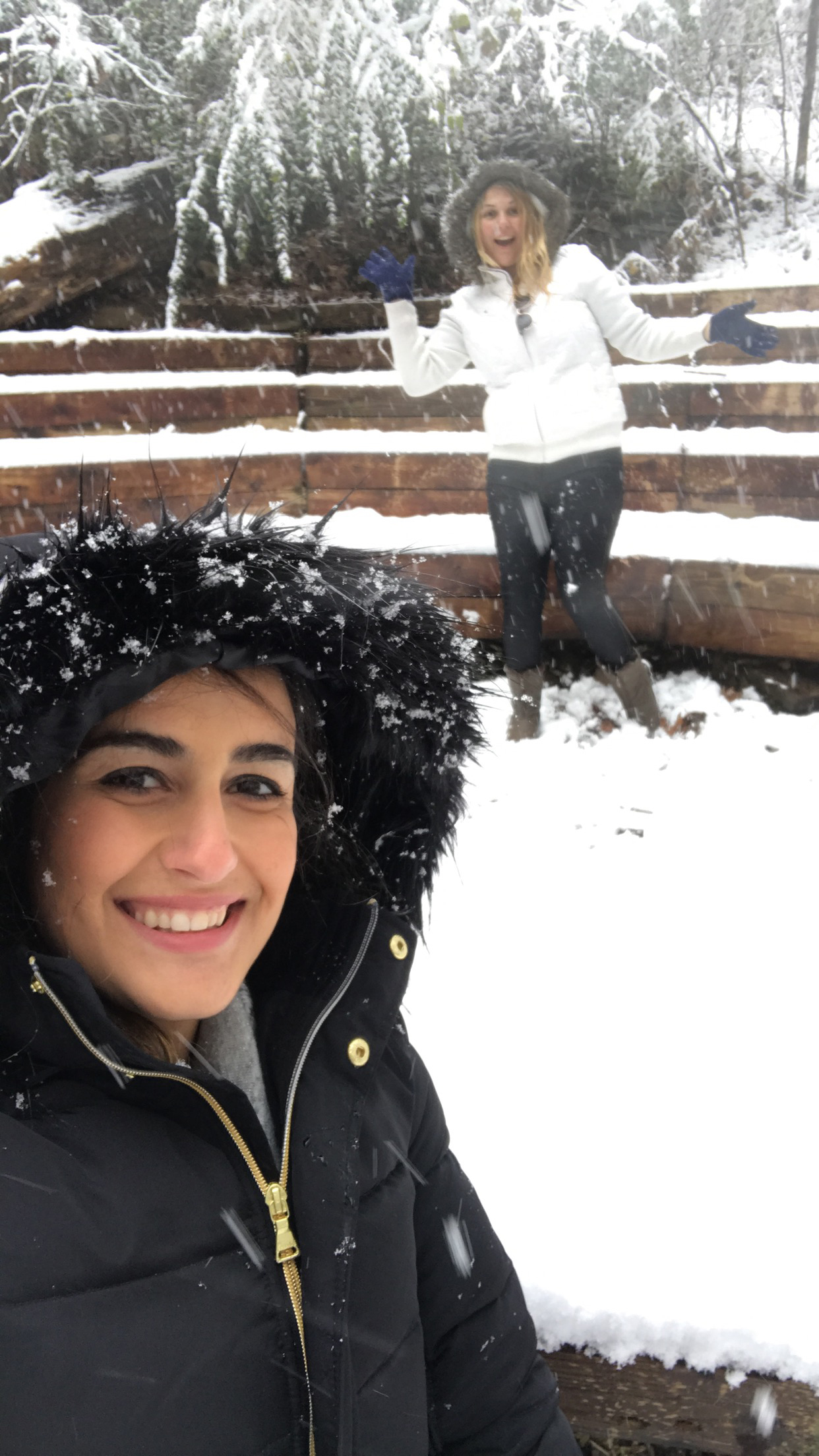 PHOTO: Natsha Bates and Christi Boston Henderson play in a rare day of snow last Friday in Vestavia Hills, Ala.