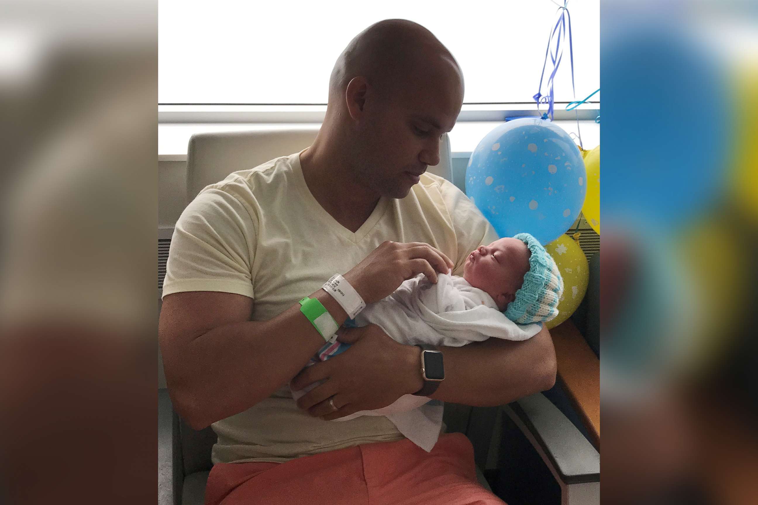 PHOTO: Michael Chuppa holds his newborn son, Blake, born July 10, 2017 at Hillcrest Hospital. Baby Blake is sporting a knit cap created by Barbara Lowe.