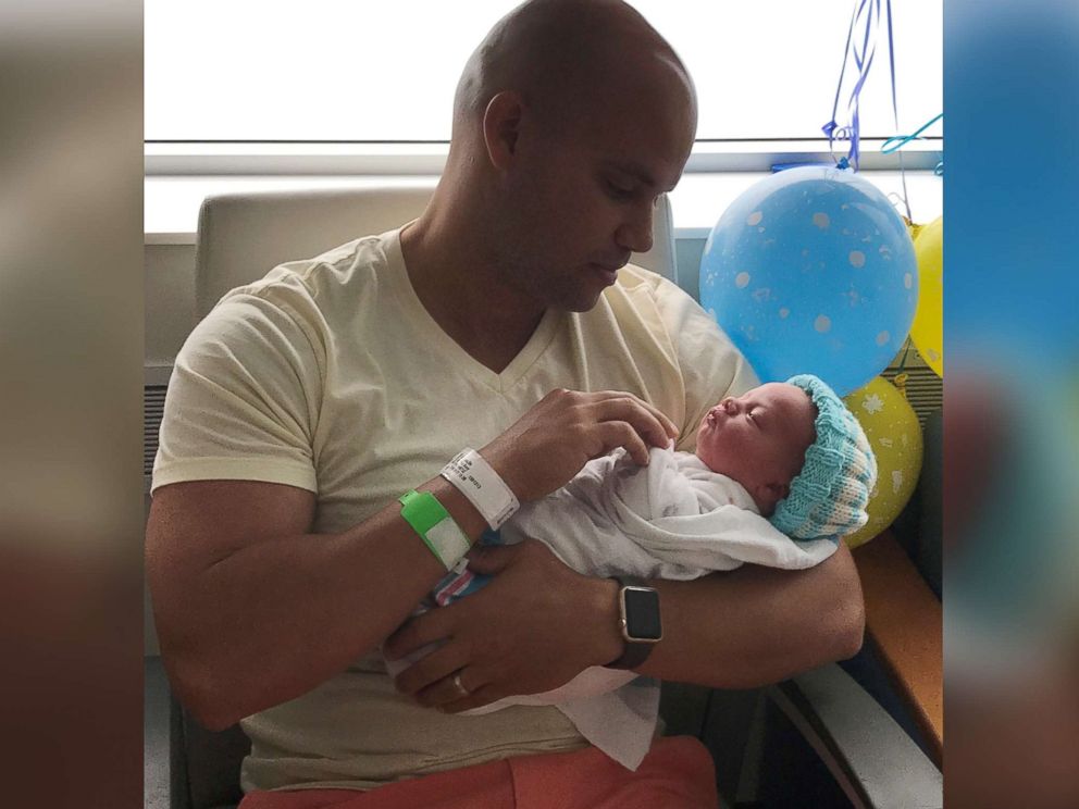 PHOTO: Michael Chuppa holds his newborn son, Blake, born July 10, 2017 at Hillcrest Hospital. Baby Blake is sporting a knit cap created by Barbara Lowe.