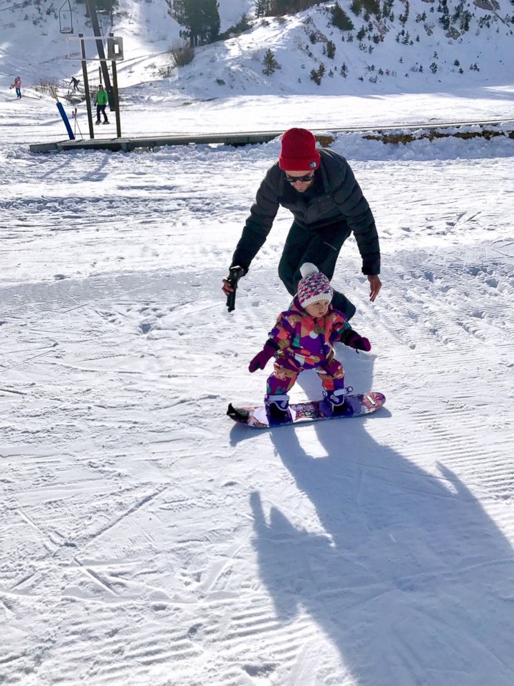 PHOTO: Nick Rowley teaching his 1-year-old daughter Cash how to snowboard.