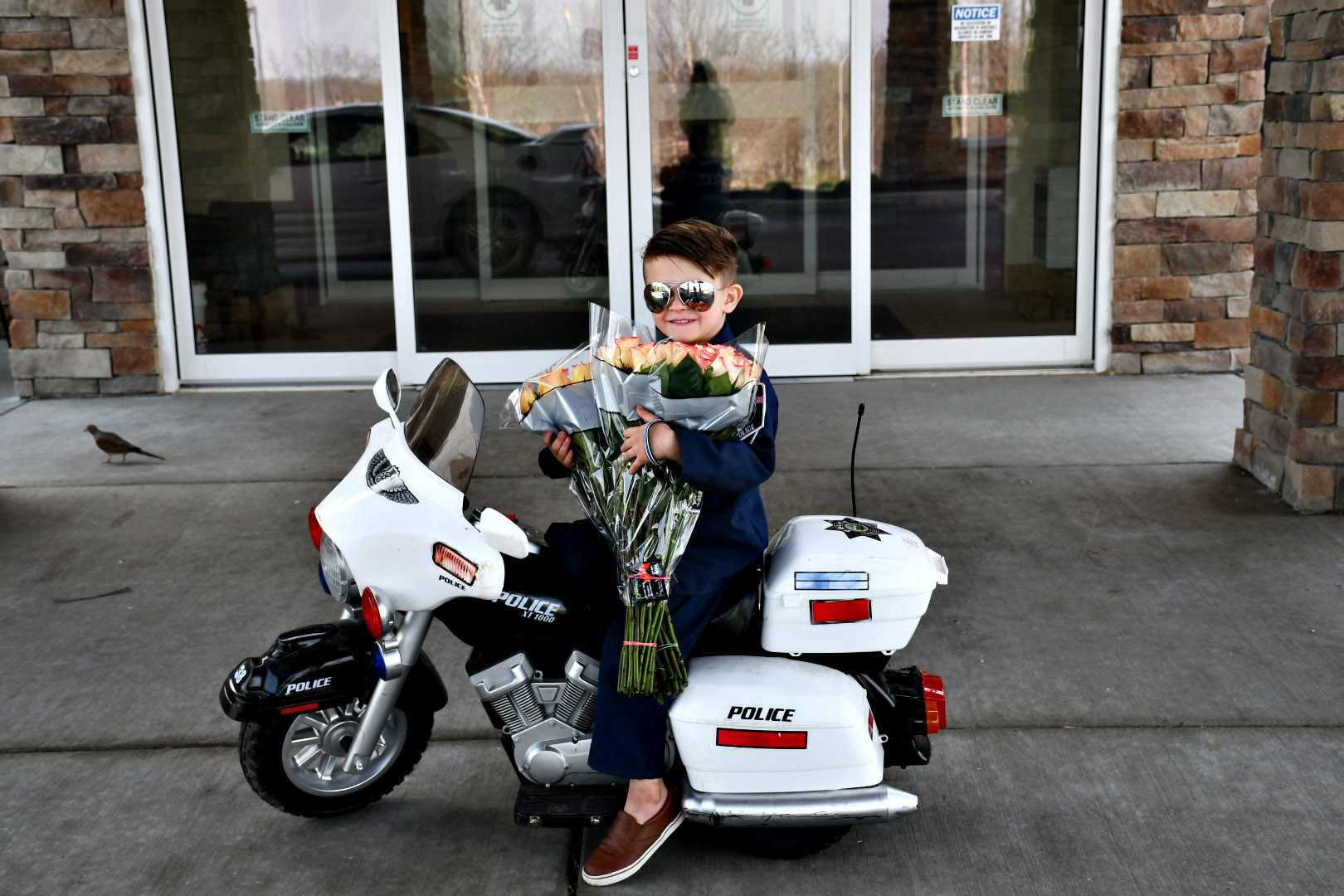 PHOTO: "Officer" Oliver Davis, 6, prepares to pass out roses and violations for "being too cute" to the senior residents of Westchester Village of Lenexa nursing home in Kansas.