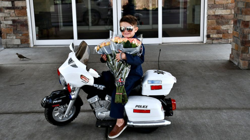 PHOTO: "Officer" Oliver Davis, 6, prepares to pass out roses and violations for "being too cute" to the senior residents of Westchester Village of Lenexa nursing home in Kansas.