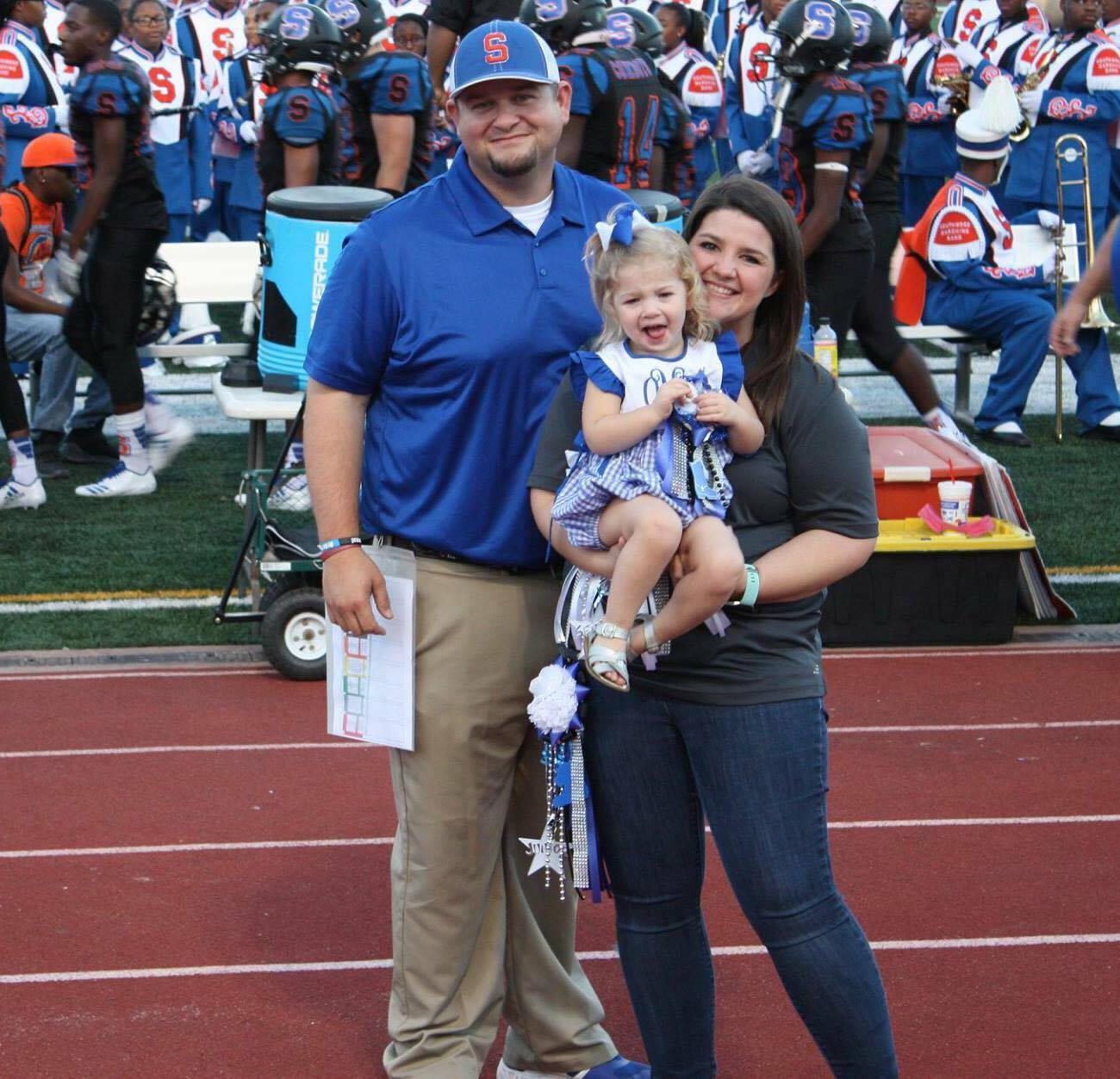 PHOTO: Ollie Malone, 2, poses in an undated photograph with her parents, Micah and Cody Malone, at Southwood High School's football game in Shreveport, La.