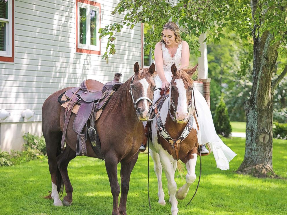 PHOTO: Patti Womer, 21, seen riding on her horse Cricket as her horse Dutch rode along side her on her wedding day, Sept. 9, 2017.