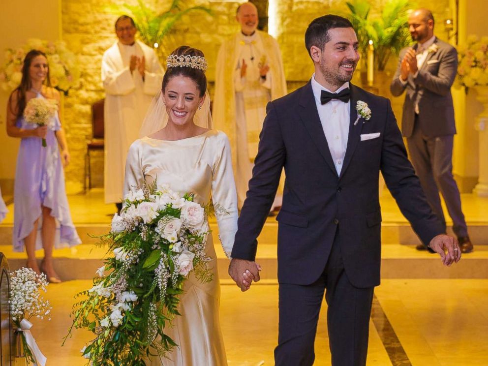 PHOTO: Pilar O'Hara Kassouf and Nick Kassouf walk down the aisle on their Sept. 23, 2017, wedding day.